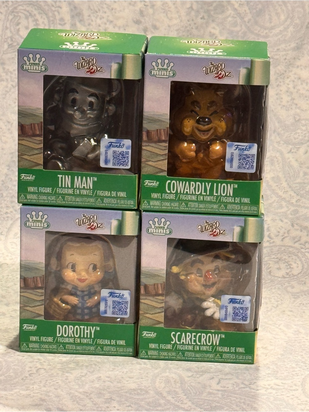 The Funko Wizard of Oz Minis Tin Man, Dorothy, Cowardly Lion, and Scarecrow set